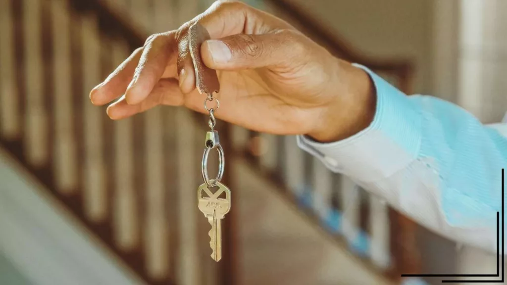 a hand holding keys to a nice rental unit