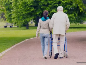 assisted living investing with a person walking on a walkway